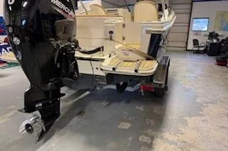 Slide: The Image of 2021 Scout 215 Dorado boat with Mercury outboard engine in a showroom. - 6