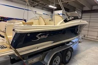 Slide: The Image of 2021 Scout 215 Dorado boat on trailer in indoor storage facility. - 7
