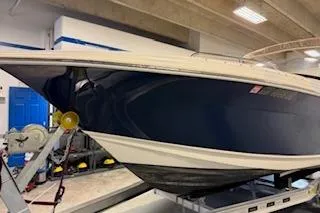Slide: The Image of 2021 Scout 215 Dorado boat in indoor storage on a trailer. - 8
