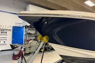 Slide: The Image of 2021 Scout 215 Dorado boat in a workshop setting. - 9