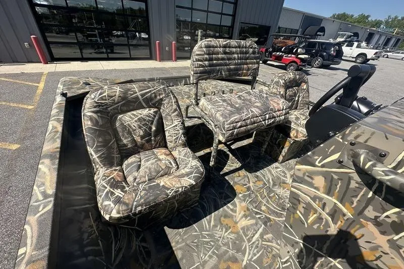 Slide: The Image of Camouflage interior of 2026 War Eagle 2170 Blackhawk boat with cushioned seating. - 4