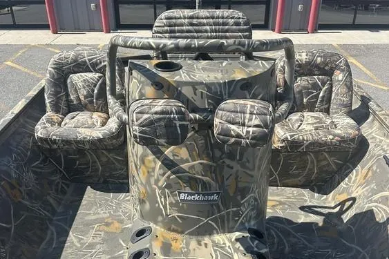 Slide: The Image of 2026 War Eagle 2170 Blackhawk boat with camouflage seating and console design. - 6