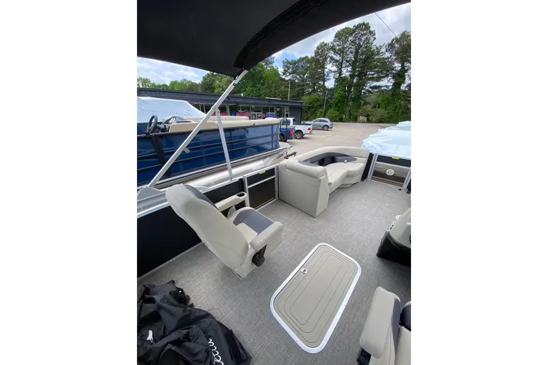 Slide: The Image of 2023 Barletta ARIA 22UC pontoon boat interior with seating and canopy. - 8