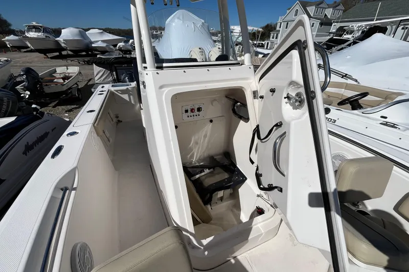 Slide: The Image of 2017 Pursuit C 238 Center Console boat interior with open storage compartment. - 14