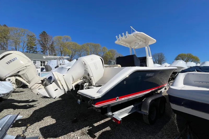 Slide: The Image of 2017 Pursuit C 238 Center Console boat with Yamaha engines on a trailer. - 3