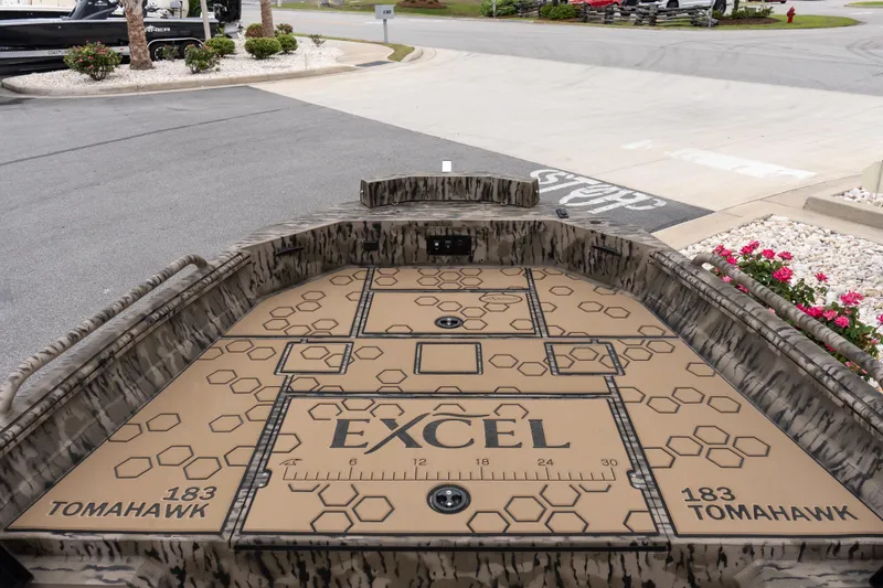 Slide: The Image of 2026 Excel 203 Bay Pro Elite boat deck with camo design and geometric patterns. - 10