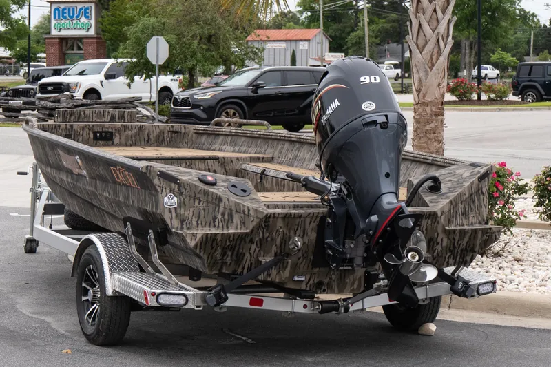 Slide: The Image of 2026 Excel 203 Bay Pro Elite boat with Yamaha motor on trailer, parked outdoors. - 3
