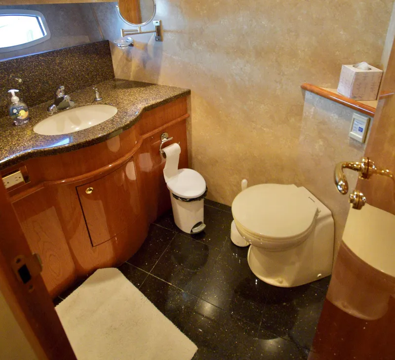 Slide: The Image of Luxurious bathroom in 2010 Neptunus 58 yacht with granite countertop and elegant fixtures. - 16