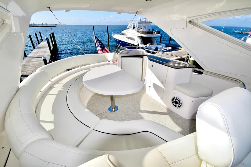 Slide: The Image of Luxurious Neptunus 58 yacht interior, 2010 model, featuring elegant seating and ocean view. - 27