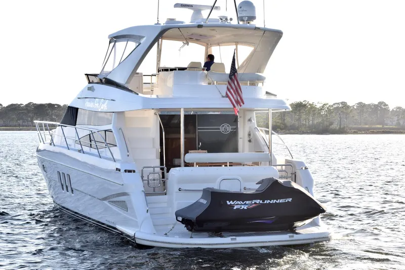 Slide: The Image of Luxury Neptunus 58 yacht cruising on water, 2010 model with WaveRunner jet ski. - 37