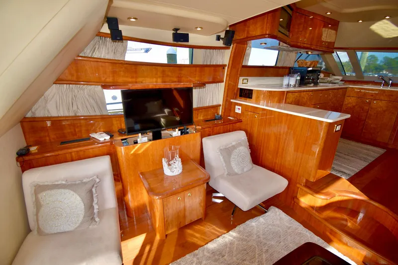 Slide: The Image of Luxurious 2010 Neptunus 58 yacht interior with elegant wood finish and modern amenities. - 4