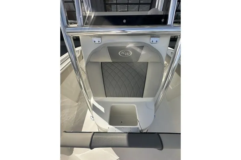 Slide: The Image of 2026 Key West 219 FS boat seat with KW logo and storage compartment. - 11