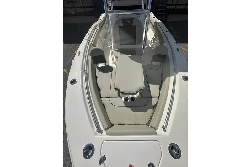 Slide: The Image of 2026 Key West 219 FS boat interior with cushioned seating and sleek design. - 15