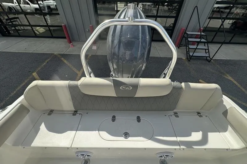 Slide: The Image of 2026 Key West 219 FS boat interior with seating and motor, viewed from above. - 18
