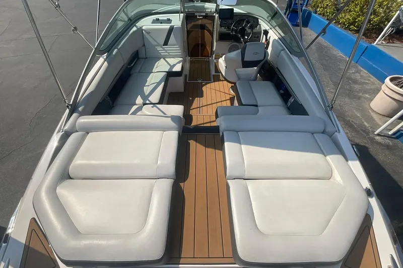 Slide: The Image of 2015 Regal 2100 Bowrider boat interior with spacious seating and sleek design. - 19