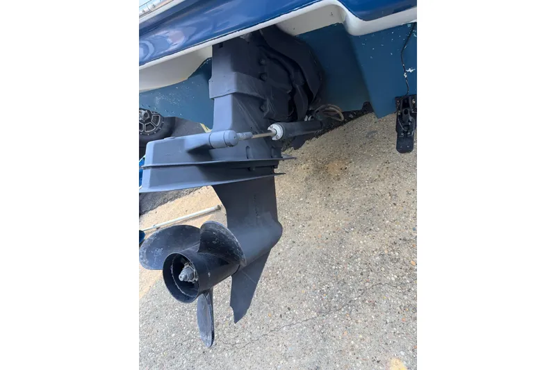 Slide: The Image of 2001 Sea Ray 210 Bow Rider boat propeller and stern drive detail. - 13