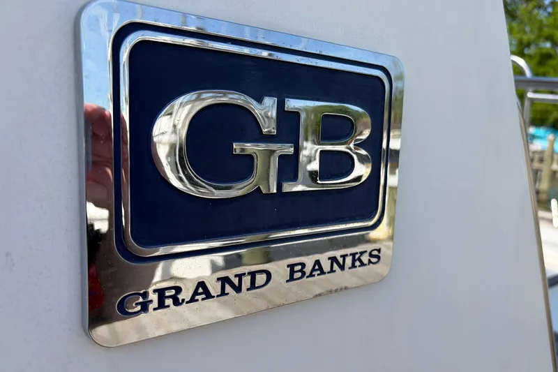 Slide: The Image of Grand Banks 42 Classic 1986 emblem with GB logo on boat exterior. - 18
