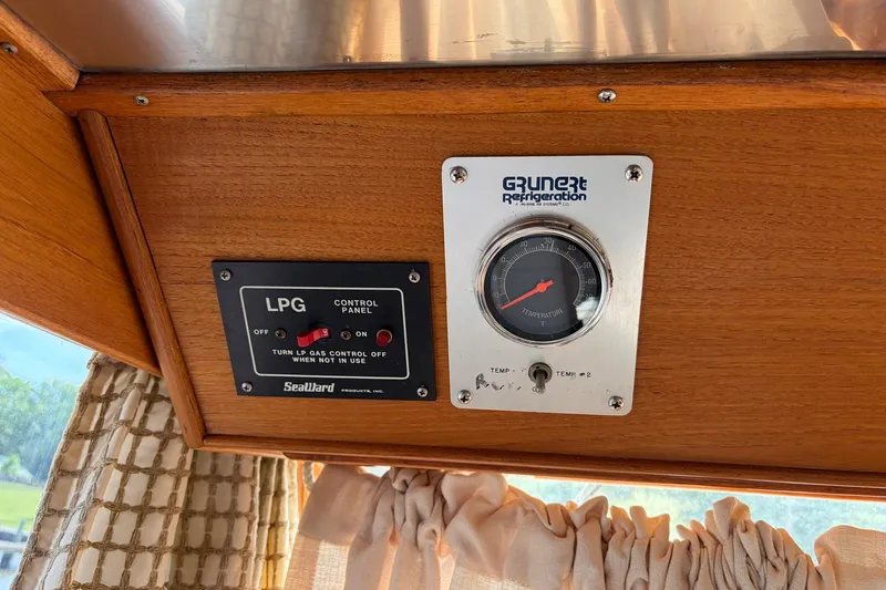 Slide: The Image of Control panel and temperature gauge on 1986 Grand Banks 42 Classic boat. - 30
