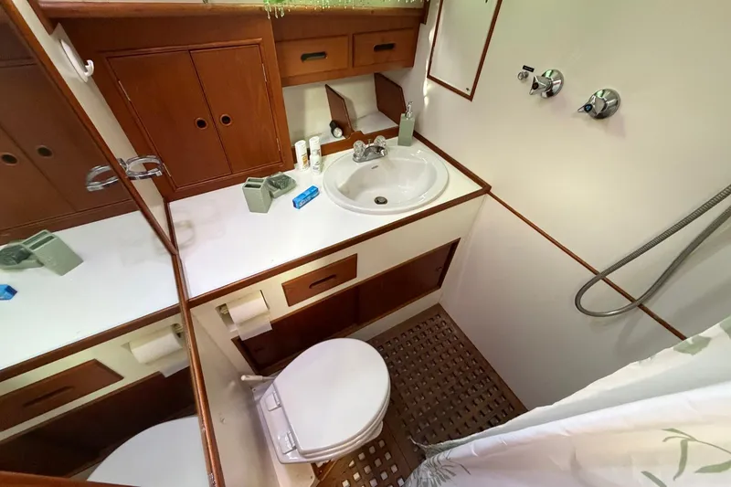 Slide: The Image of Bathroom interior of 1986 Grand Banks 42 Classic yacht, featuring sink, toilet, and shower. - 32