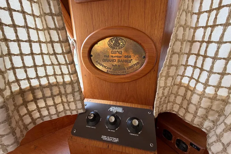 Slide: The Image of Plaque and controls on 1986 Grand Banks 42 Classic boat interior. - 33