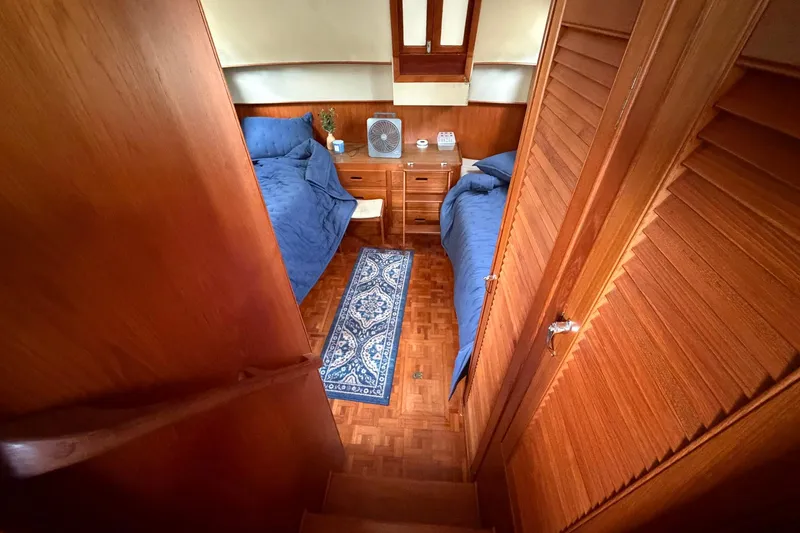 Slide: The Image of Cozy cabin interior of 1986 Grand Banks 42 Classic yacht with twin beds and wooden decor. - 35