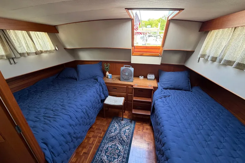 Slide: The Image of Twin beds in a cozy cabin of a 1986 Grand Banks 42 Classic yacht. - 37