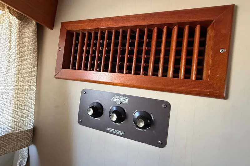 Slide: The Image of Wooden air vent and control panel in 1986 Grand Banks 42 Classic yacht interior. - 40