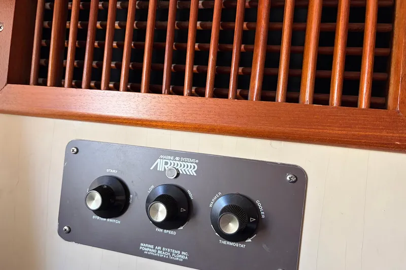Slide: The Image of Control panel of a 1986 Grand Banks 42 Classic boat with wooden vent grille. - 41