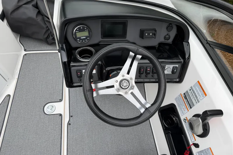 Slide: The Image of 2019 Yamaha Boats SX195 dashboard with steering wheel and control panel. - 11