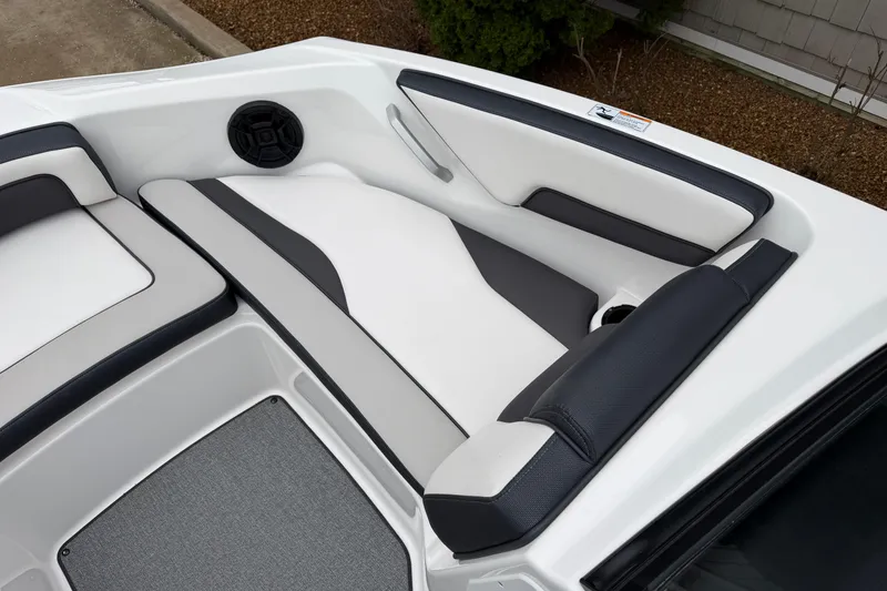 Slide: The Image of 2019 Yamaha Boats SX195 interior seating with sleek design and speaker system. - 14
