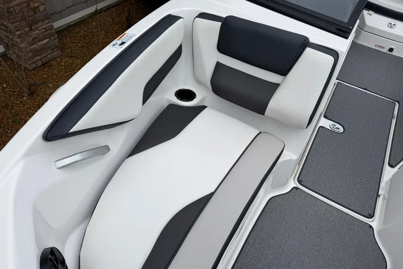 Slide: The Image of 2019 Yamaha Boats SX195 interior seating with sleek black and white upholstery design. - 16
