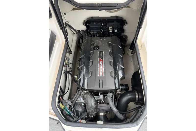 Slide: The Image of Engine compartment of a 2019 Yamaha Boats SX195, showcasing the powerful motor. - 5