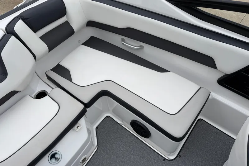Slide: The Image of 2019 Yamaha Boats SX195 interior seating with sleek black and white design. - 8