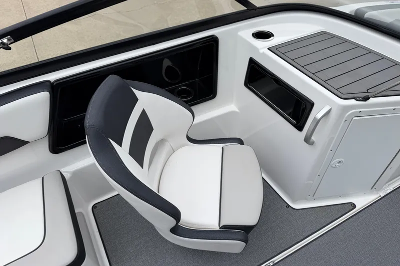 Slide: The Image of 2019 Yamaha Boats SX195 interior with sleek seating and modern dashboard design. - 9