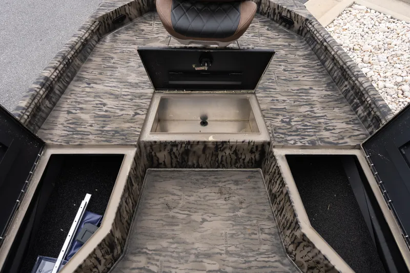 Slide: The Image of Interior view of 2026 Excel 203 Bay Pro Elite boat with storage compartments. - 11