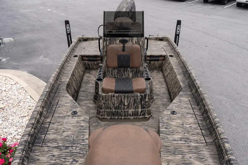 Slide: The Image of 2026 Excel 203 Bay Pro Elite boat with camouflage design and brown seating. - 12