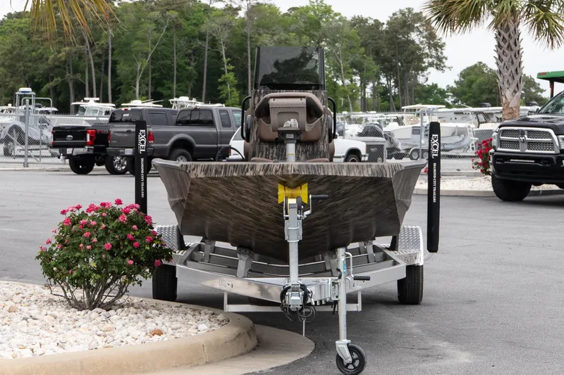 Slide: The Image of 2026 Excel 203 Bay Pro Elite boat on trailer in parking lot. - 3