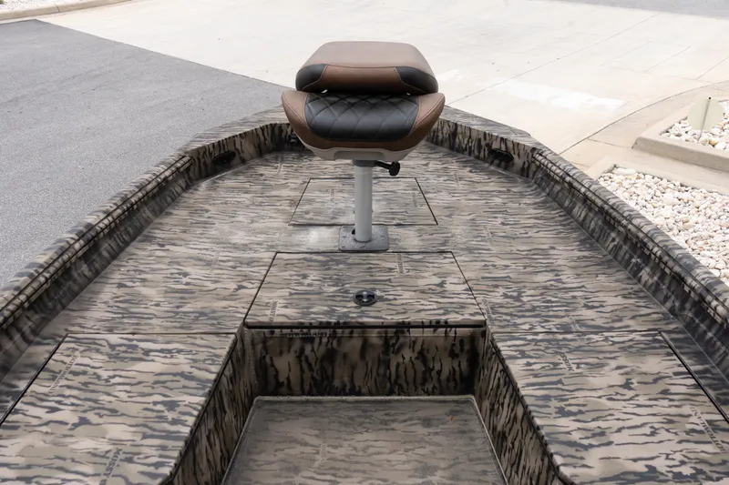 Slide: The Image of 2026 Excel 203 Bay Pro Elite boat with camo deck and swivel seat. - 9