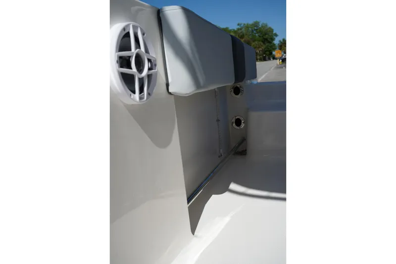 Slide: The Image of Interior view of 2026 Robalo R202 Explorer boat, featuring speaker and seating. - 14