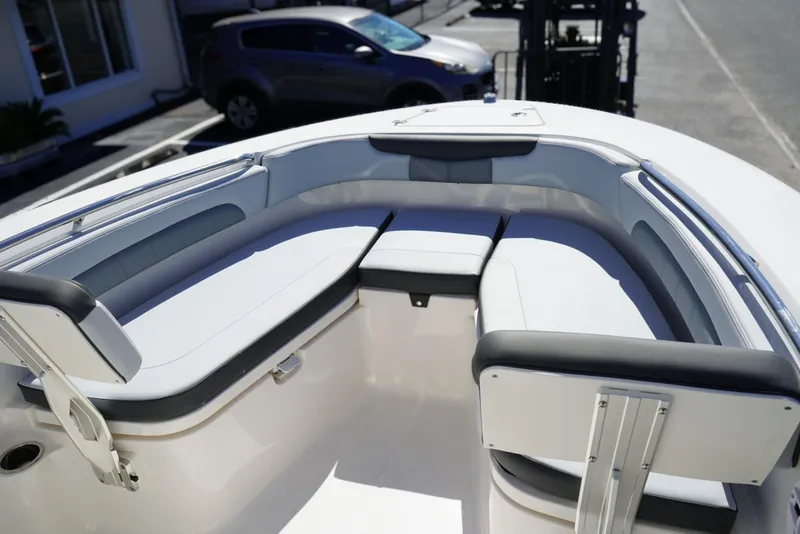 Slide: The Image of 2026 Robalo R202 Explorer boat interior with cushioned seating and sleek design. - 15