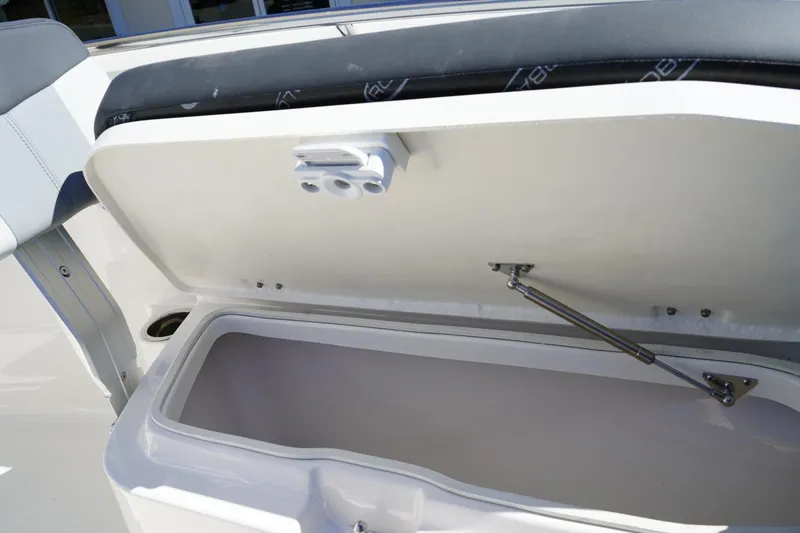 Slide: The Image of Open storage compartment on 2026 Robalo R202 Explorer boat. - 17