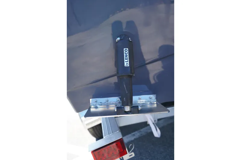 Slide: The Image of Trim tab on 2026 Robalo R202 Explorer boat with Lenco actuator. - 3