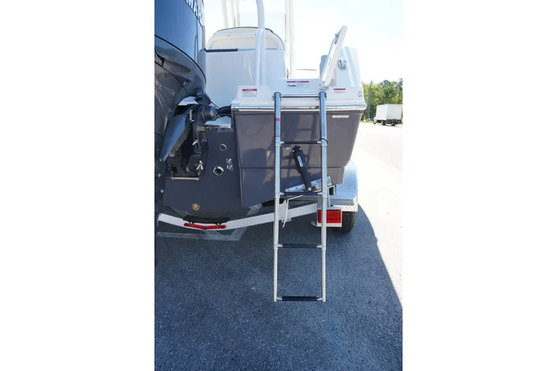 Slide: The Image of 2026 Robalo R202 Explorer boat with rear ladder and outboard motor. - 5