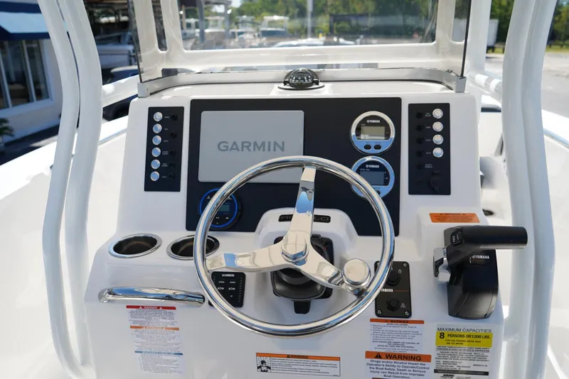 Slide: The Image of Helm of 2026 Robalo R202 Explorer featuring Garmin navigation and Yamaha controls. - 6