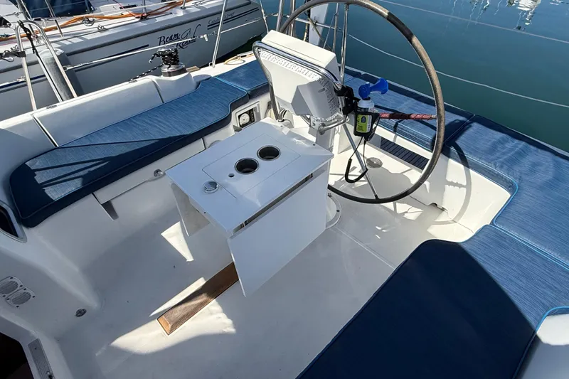 Slide: The Image of Cockpit of 2012 Beneteau Oceanis 37 sailboat with steering wheel and seating. - 32