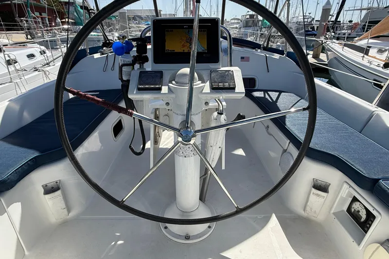 Slide: The Image of Cockpit of 2012 Beneteau Oceanis 37 sailboat with steering wheel and navigation equipment. - 33