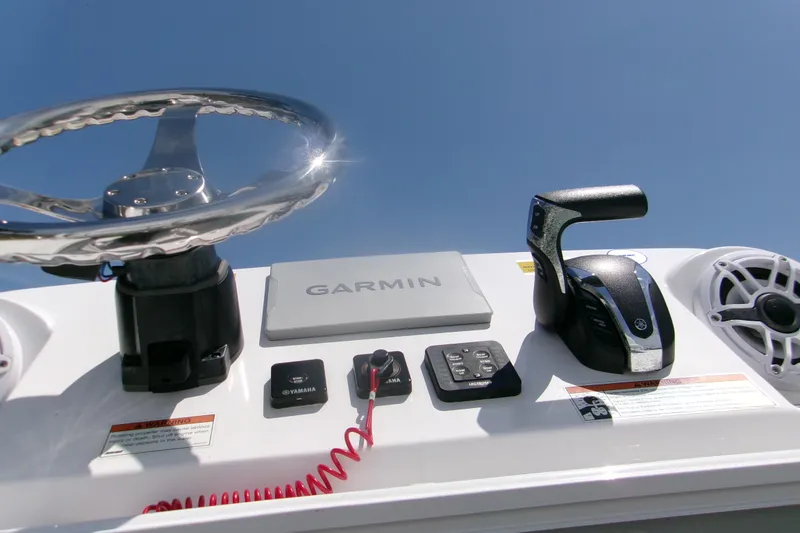Slide: The Image of Control panel of 2023 Sportsman Masters 247 Bay Boat with Garmin navigation system. - 8
