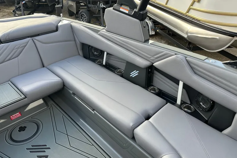 Slide: The Image of Luxurious interior of 2026 ATX Surf Boats 22 Type-S with sleek gray seating. - 12