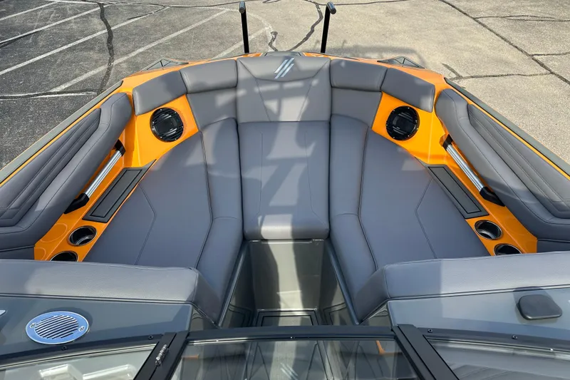 Slide: The Image of 2026 ATX Surf Boats 22 Type-S interior with gray seating and orange accents. - 17