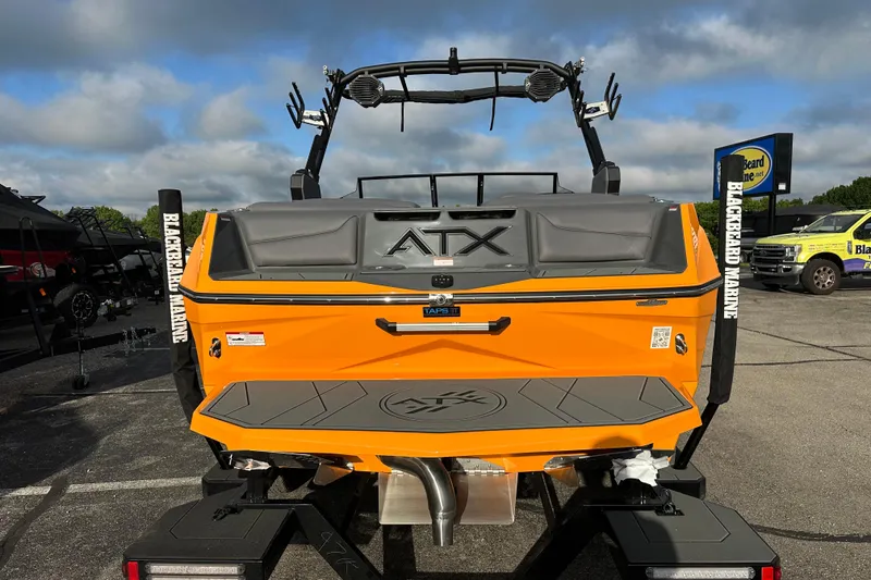 Slide: The Image of 2026 ATX Surf Boats 22 Type-S in vibrant orange at Blackbeard Marine dealership. - 4